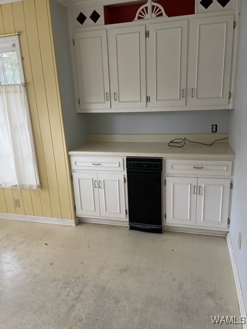 kitchen with light wood-type flooring and white cabinetry