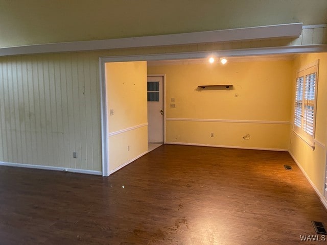 spare room with dark hardwood / wood-style floors