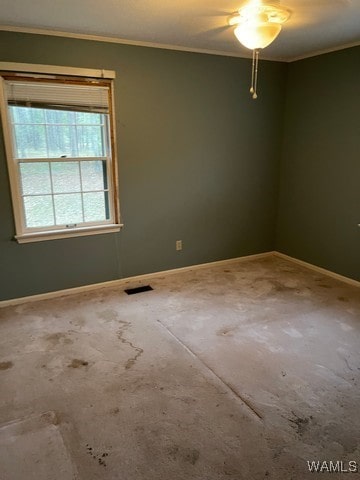 carpeted empty room featuring ornamental molding