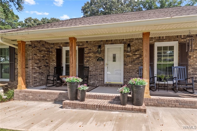 property entrance with covered porch