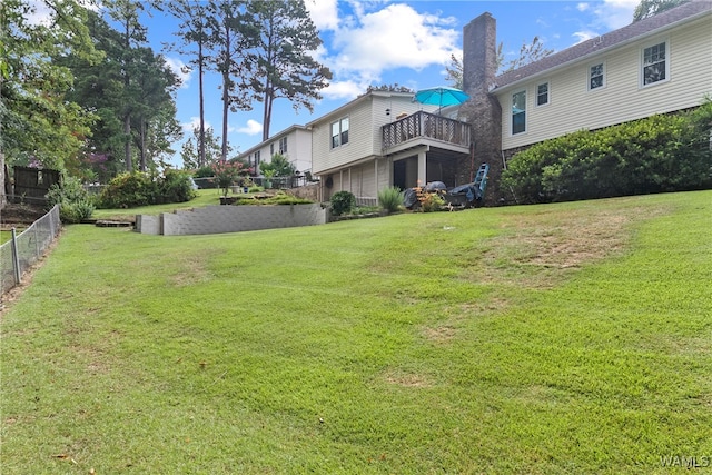 view of yard featuring a balcony