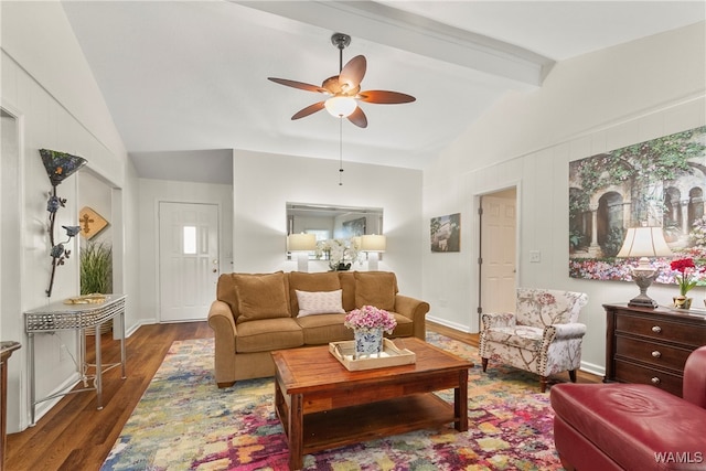 living room featuring vaulted ceiling with beams, dark hardwood / wood-style floors, and ceiling fan