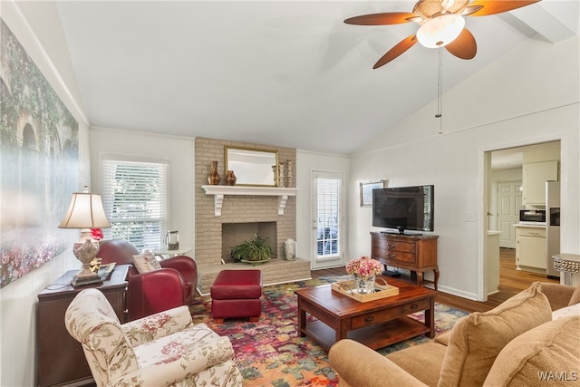 living room with high vaulted ceiling, ceiling fan, a fireplace, beamed ceiling, and wood-type flooring