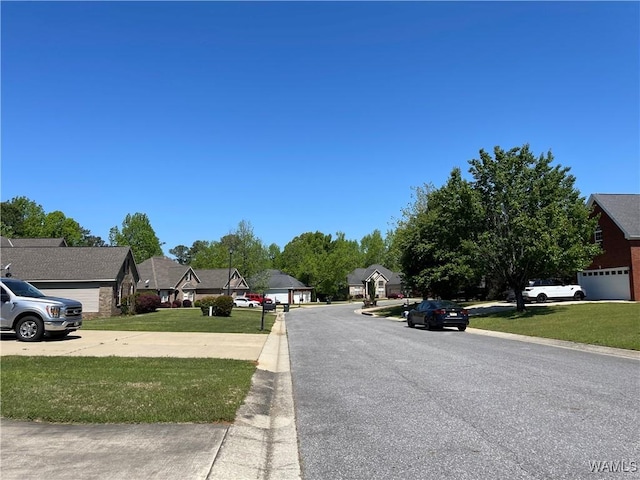view of street featuring a residential view and curbs