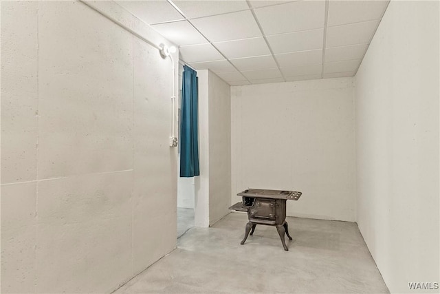 basement featuring a paneled ceiling