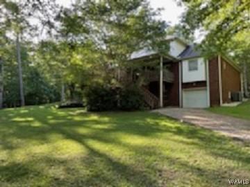 view of front of property with an attached garage and a front yard