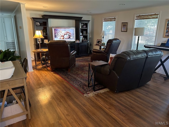 living room featuring ornamental molding and hardwood / wood-style flooring