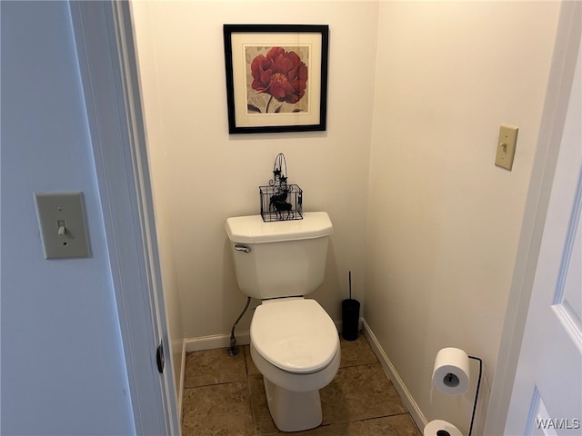 bathroom featuring tile patterned floors and toilet