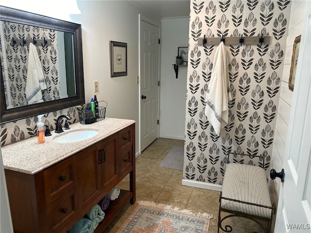 bathroom with tile patterned floors and vanity