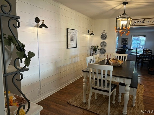 dining room with a chandelier and dark hardwood / wood-style floors