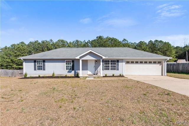 ranch-style house featuring concrete driveway, an attached garage, fence, and a front yard