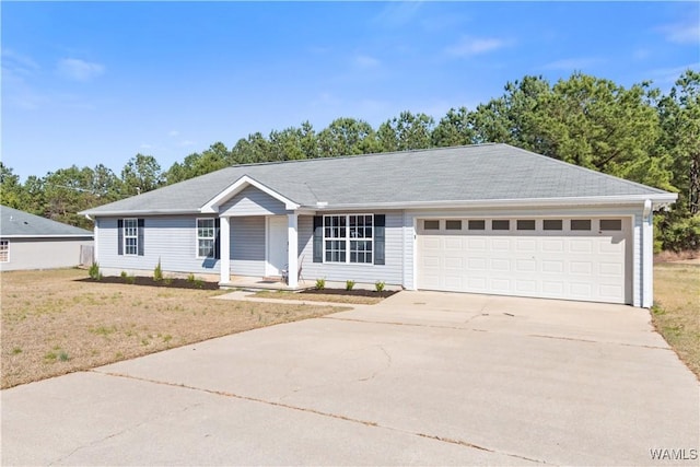 ranch-style house featuring a garage, concrete driveway, and a front lawn