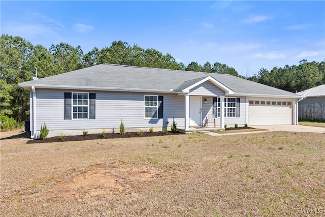 ranch-style home with a front lawn, concrete driveway, and an attached garage