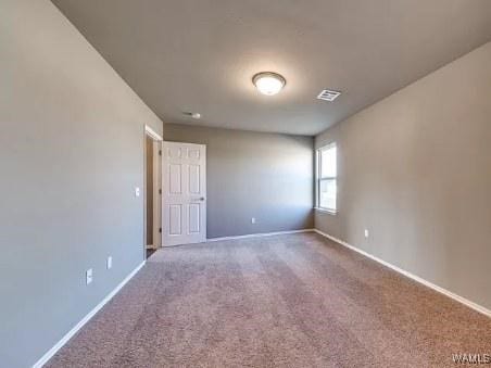 spare room with carpet flooring