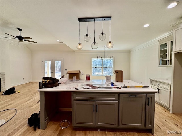 kitchen with a healthy amount of sunlight, light countertops, and french doors