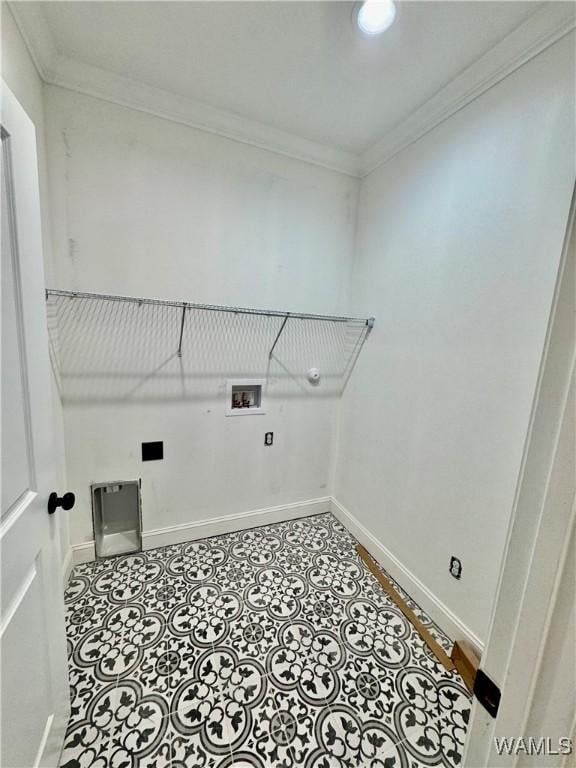 laundry area featuring laundry area, hookup for a washing machine, baseboards, and crown molding