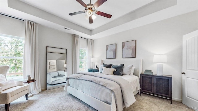 9343 Havenridge Loop, Tuscaloosa, AL 35405 - bedroom featuring light carpet, multiple windows, and a ceiling fan