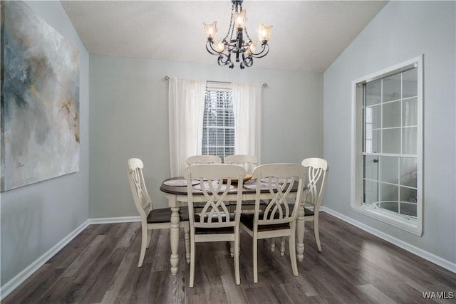 dining space with lofted ceiling, dark hardwood / wood-style flooring, and a notable chandelier