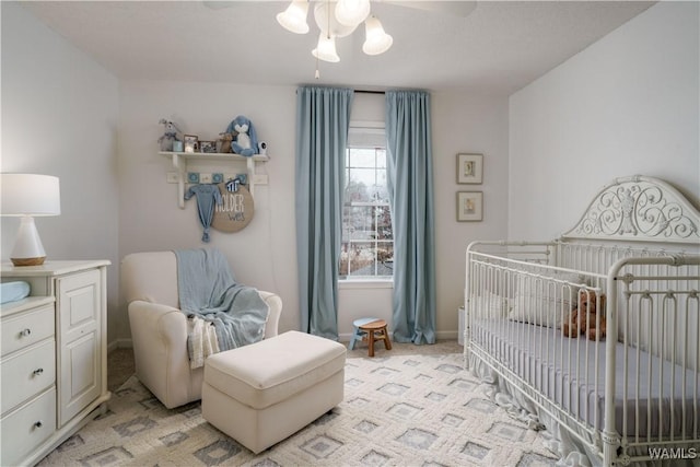 bedroom with light colored carpet and ceiling fan