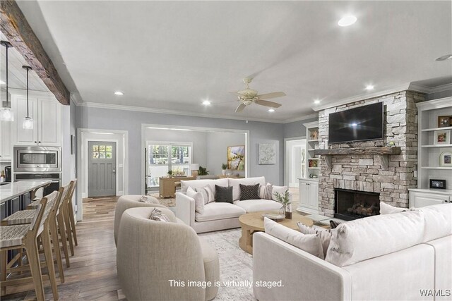 10649 Legacy Point Dr, Northport, AL 35475 - living area with recessed lighting, a stone fireplace, light wood-style floors, ceiling fan, and crown molding