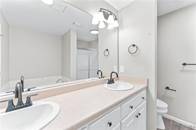 full bathroom featuring a sink, visible vents, toilet, and a stall shower