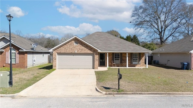 single story home with brick siding, an attached garage, a front lawn, covered porch, and driveway