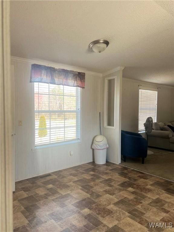 12443 Reed Simpson Rd, Northport, AL 35475 - living room featuring plenty of natural light, a textured ceiling, and crown molding