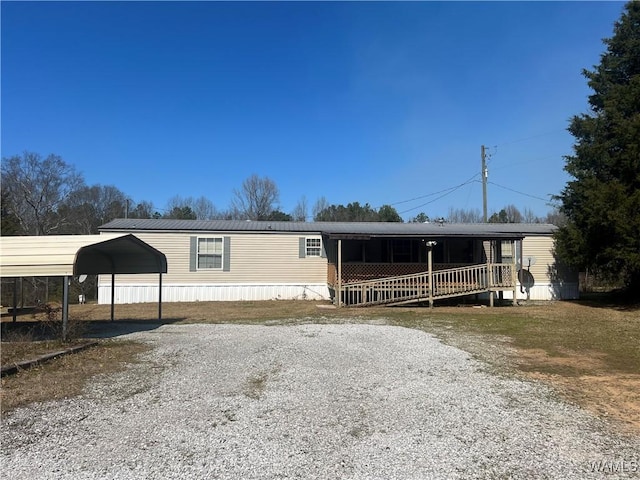 12443 Reed Simpson Rd, Northport, AL 35475 - manufactured / mobile home with driveway and a detached carport