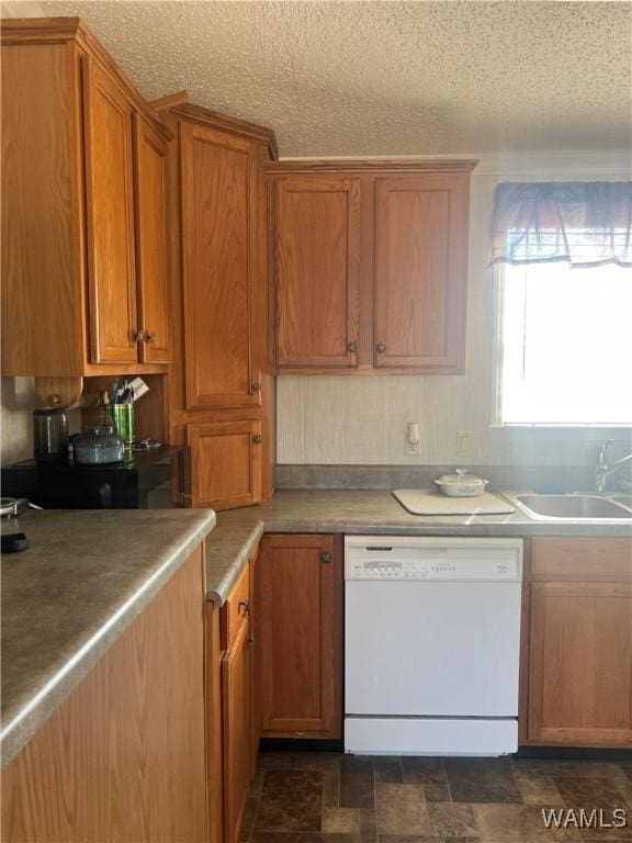 12443 Reed Simpson Rd, Northport, AL 35475 - kitchen featuring white dishwasher, a sink, brown cabinetry, stone finish floors, and a textured ceiling