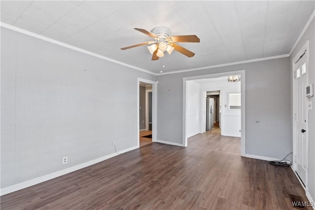 unfurnished room with ornamental molding, wood finished floors, a ceiling fan, and baseboards