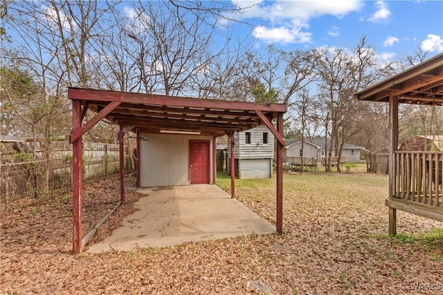 view of yard with an outbuilding and fence