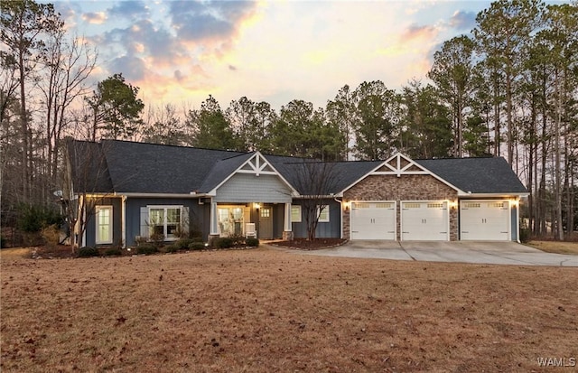 craftsman inspired home with a garage and driveway