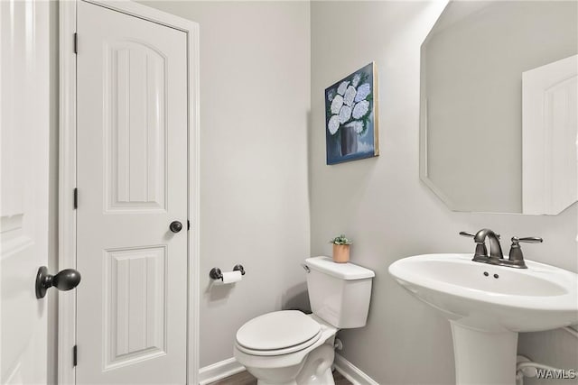 2757 Lily Cir, Northport, AL 35473 - half bath featuring toilet and baseboards