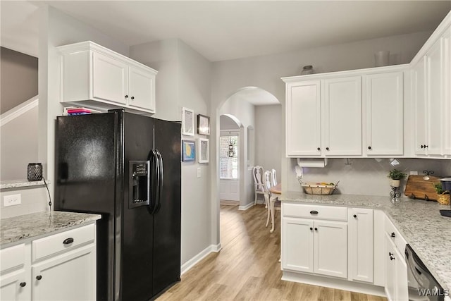 2757 Lily Cir, Northport, AL 35473 - kitchen featuring black refrigerator with ice dispenser, arched walkways, light wood-style flooring, white cabinetry, and dishwasher