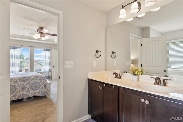 2757 Lily Cir, Northport, AL 35473 - ensuite bathroom with double vanity and ceiling fan