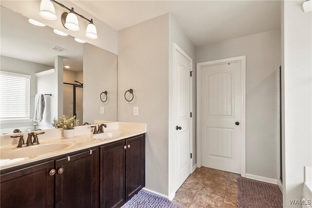 2757 Lily Cir, Northport, AL 35473 - bathroom with double vanity and an enclosed shower