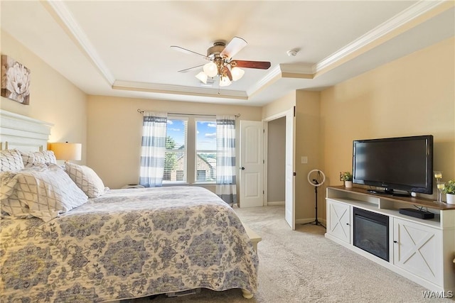 2757 Lily Cir, Northport, AL 35473 - bedroom with a raised ceiling, ornamental molding, light carpet, and a ceiling fan