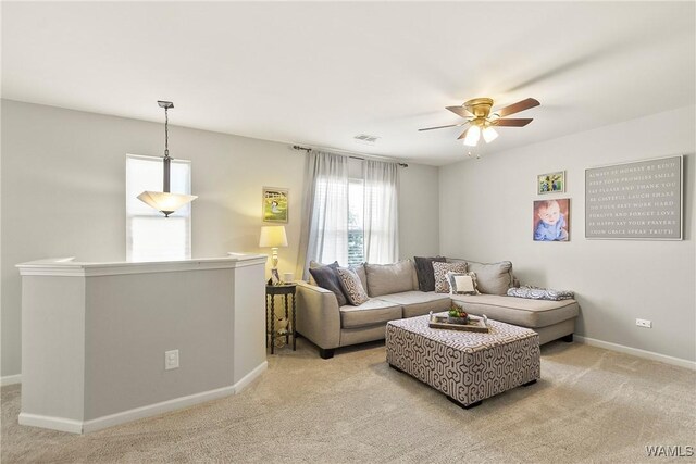 2757 Lily Cir, Northport, AL 35473 - living area featuring light colored carpet and ceiling fan