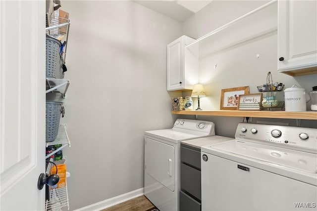 2757 Lily Cir, Northport, AL 35473 - washroom featuring cabinet space, washer and clothes dryer, and wood finished floors