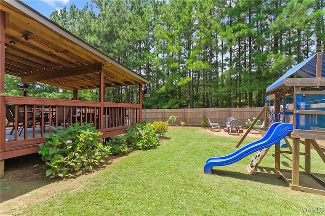 2757 Lily Cir, Northport, AL 35473 - fenced yard with a playground and a wooden deck