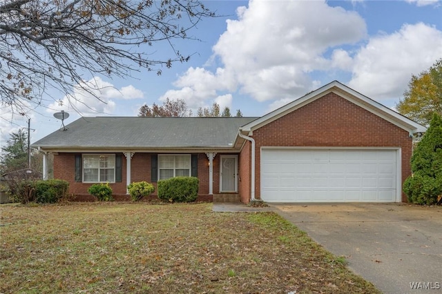 ranch-style home with a front yard and a garage