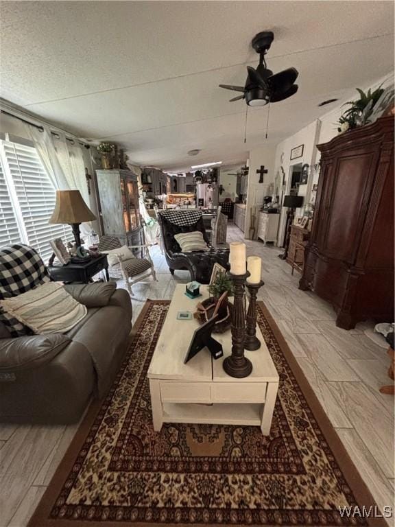 743 Greentree Dr, West Blocton, AL 35188 - living area featuring a ceiling fan and a textured ceiling