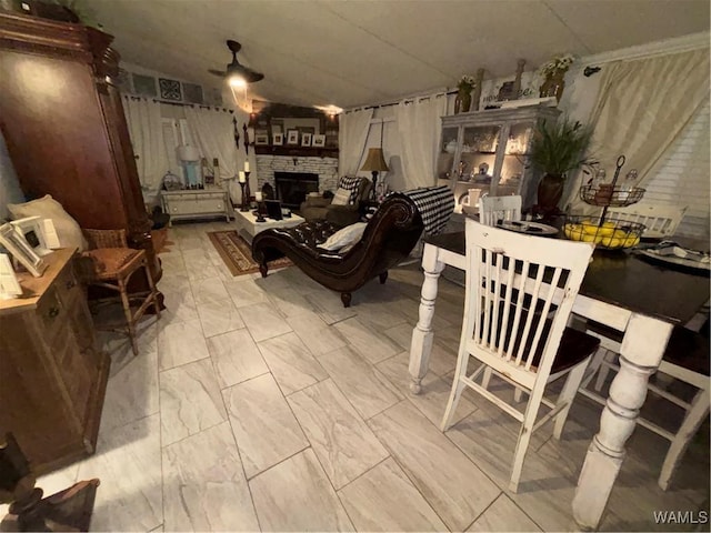 743 Greentree Dr, West Blocton, AL 35188 - dining space with a stone fireplace, ceiling fan, and marble finish floors