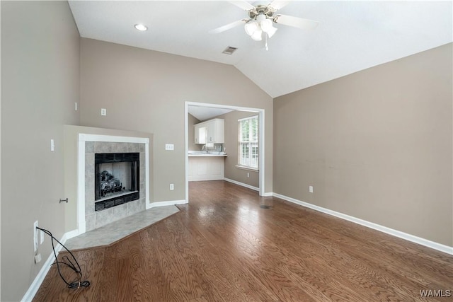 6128 Covington Villas Dr, Tuscaloosa, AL 35405 - unfurnished living room featuring a ceiling fan, wood finished floors, a fireplace, and lofted ceiling