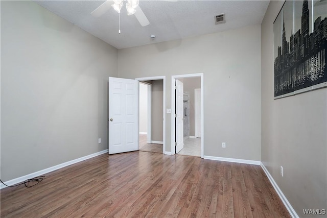 6128 Covington Villas Dr, Tuscaloosa, AL 35405 - unfurnished bedroom featuring wood finished floors and ceiling fan