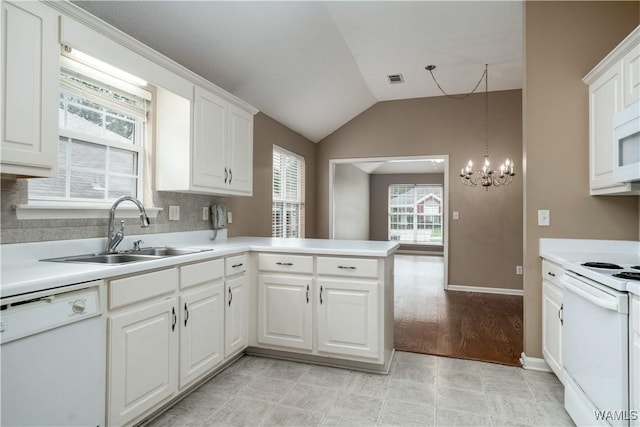 6128 Covington Villas Dr, Tuscaloosa, AL 35405 - kitchen featuring white appliances, vaulted ceiling, light countertops, white cabinets, and a chandelier