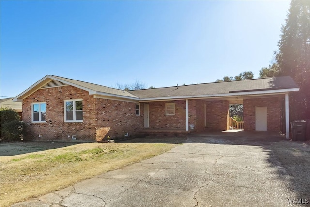 ranch-style home with a carport