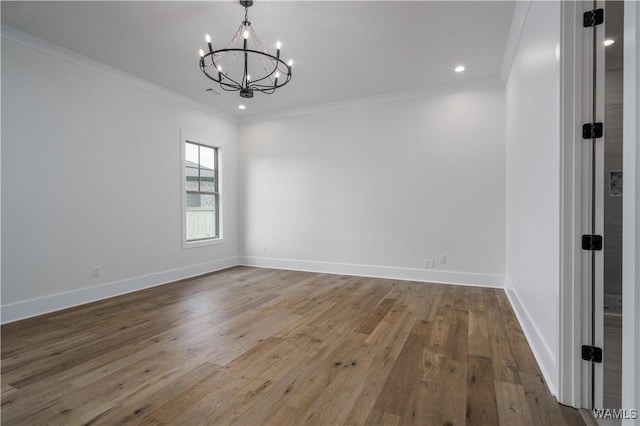 407 Edgefield Mews Cir, Tuscaloosa, AL 35406 - unfurnished room with a chandelier, ornamental molding, wood finished floors, and recessed lighting