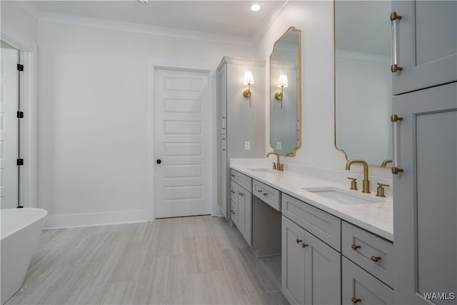 407 Edgefield Mews Cir, Tuscaloosa, AL 35406 - bathroom featuring double vanity, a freestanding tub, and crown molding