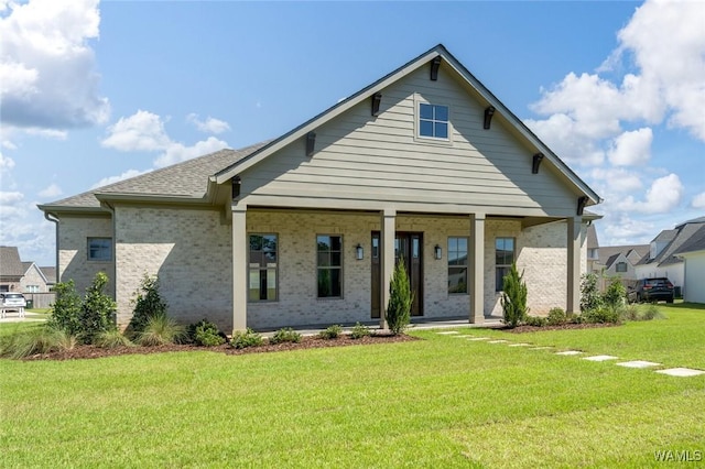 407 Edgefield Mews Cir, Tuscaloosa, AL 35406 - view of front facade featuring covered porch, a front yard, and brick siding
